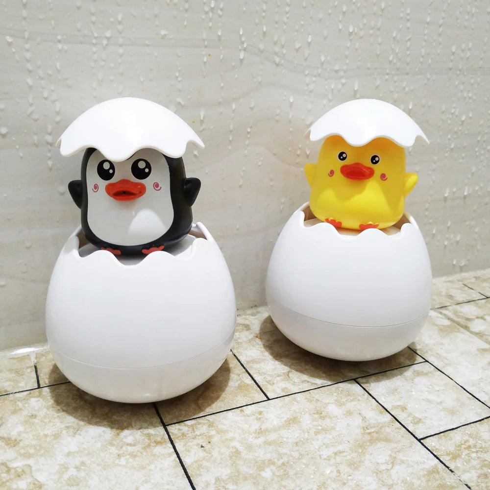 Juguete de Baño para Bebés: Divertido Patito Pingüino con Huevo de Agua - Juguete de Rociador para la Ducha, Piscina y Regalo Infantil