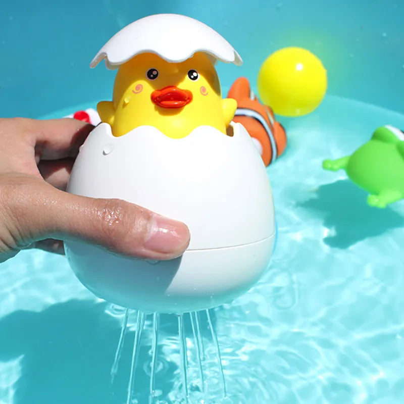 Juguete de Baño para Bebés: Divertido Patito Pingüino con Huevo de Agua - Juguete de Rociador para la Ducha, Piscina y Regalo Infantil