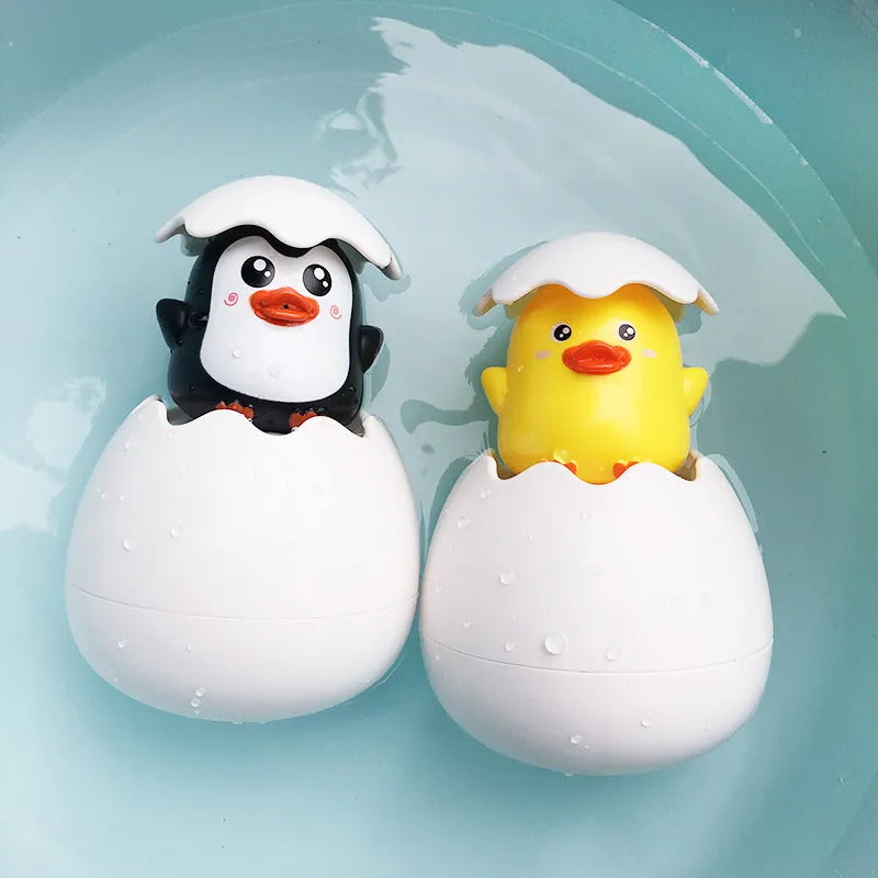 Juguete de Baño para Bebés: Divertido Patito Pingüino con Huevo de Agua - Juguete de Rociador para la Ducha, Piscina y Regalo Infantil