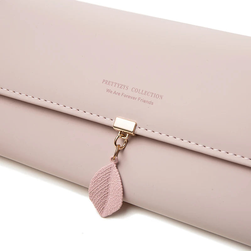 Hot Selling spring and summer new women's PU leather Japanese and South Korea small fresh leaf pendant three fold bag large capa