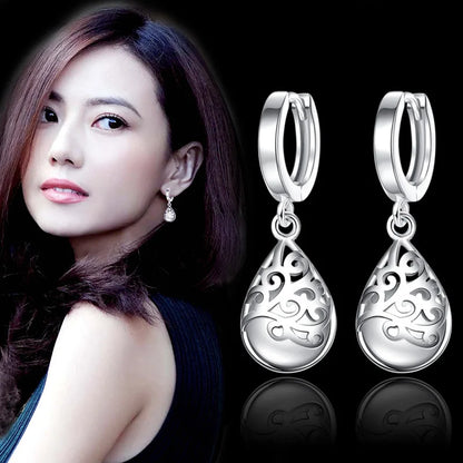 Aretes de Mujer de Flor con Piedra Ópalo en Plata de Ley 925 - Joyería Original Antialérgica